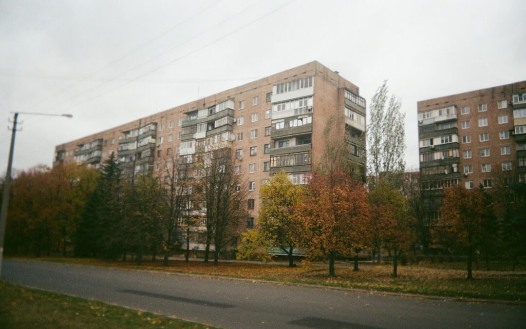 brown concrete building near trees during daytime