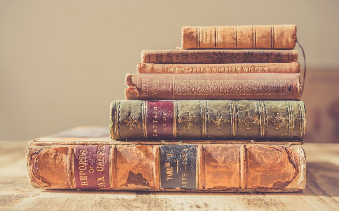 shallow focus photography of stack of books