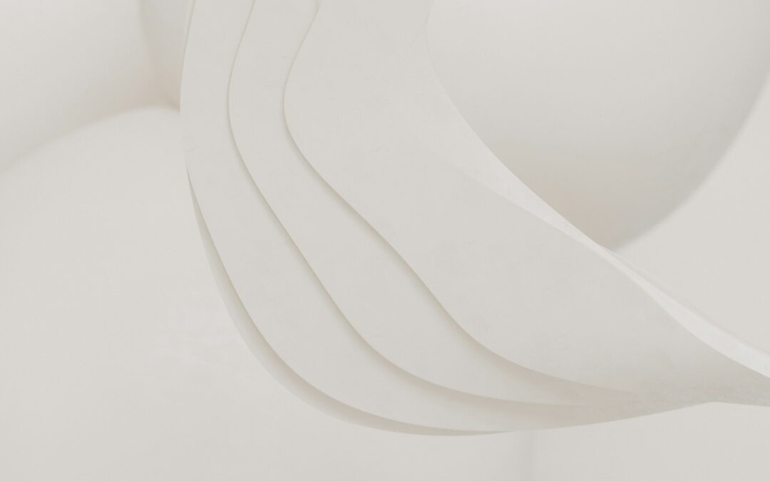 A close up of a white sculpture with curved lines