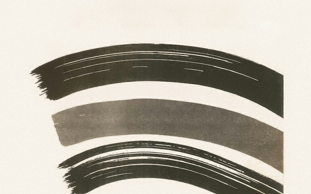 A black and white photo of a curved brush stroke